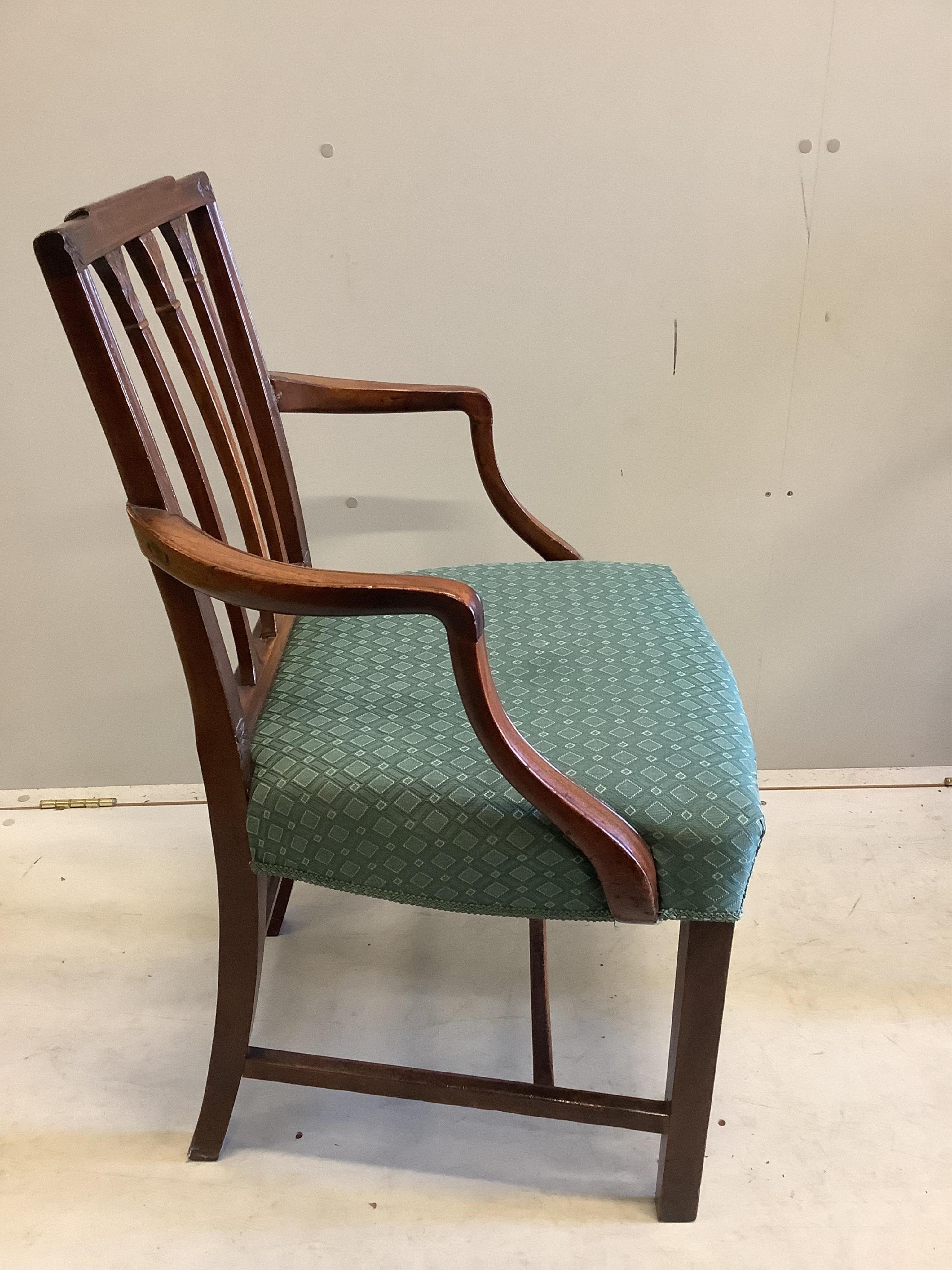 A set of six Sheraton style mahogany dining chairs (two with arms). Condition - fair